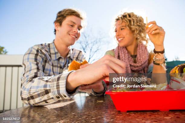 eating fast food hamburgers - french fries stock pictures, royalty-free photos & images