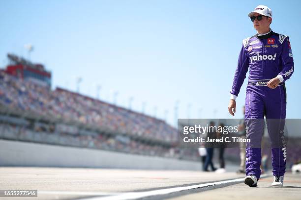 Christopher Bell, driver of the Yahoo! Toyota, walks the gridduring qualifying for the NASCAR Cup Series Cook Out Southern 500 at Darlington Raceway...