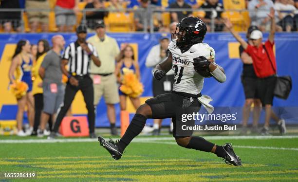 Corey Kiner of the Cincinnati Bearcats goes into the end zone for a 7-yard touchdown run in the second quarter during the game against the Pittsburgh...