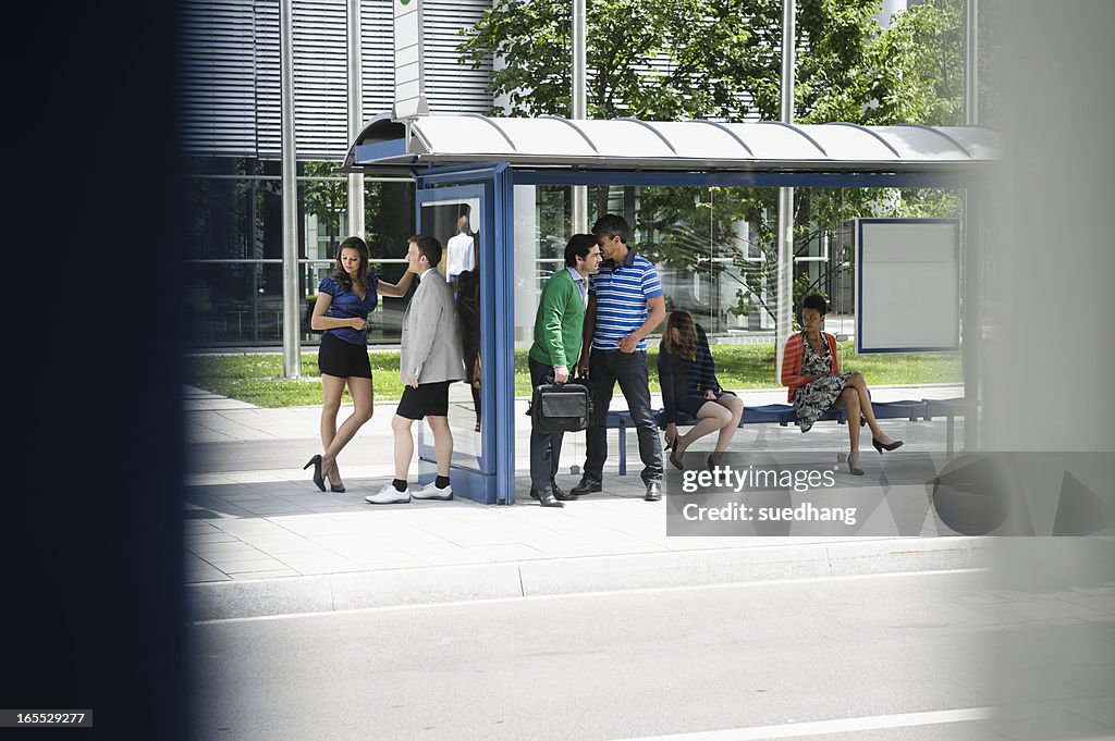 People waiting at bus stop