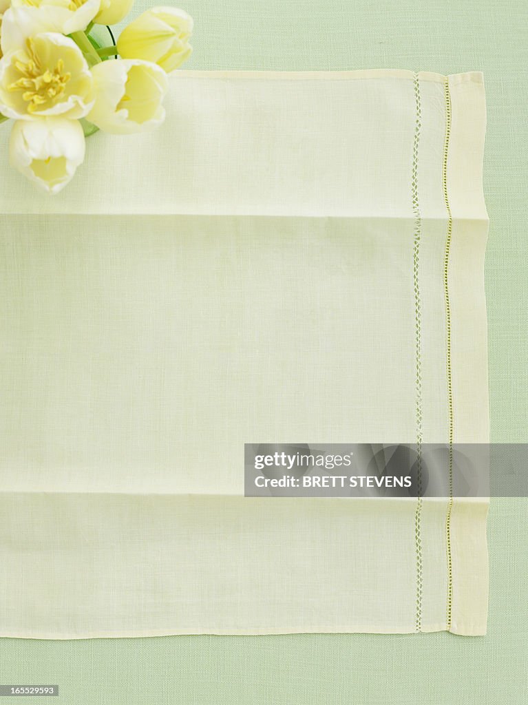 Table cloth with vase of tulips