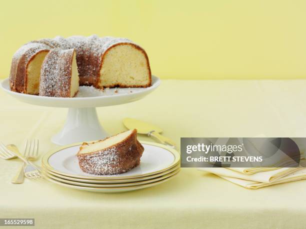 plate of lemon cake with sugar - lemon cake stock pictures, royalty-free photos & images