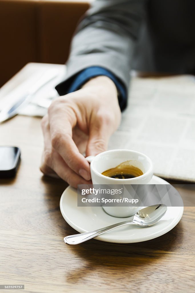 Businessman drinking cappuccino