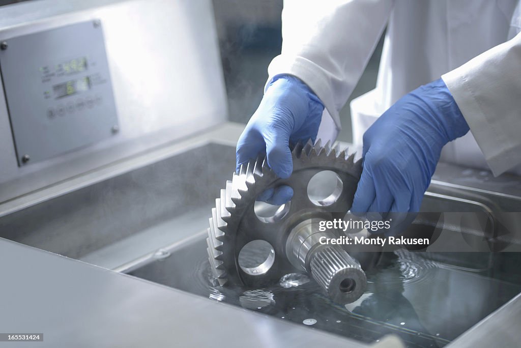 Worker holding part, cleaning engineering products using ultrasonics