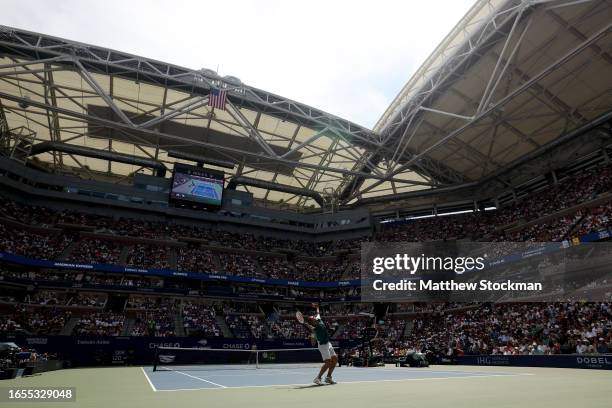 Daniel Evans of Great Britain serves against Carlos Alcaraz of Spain during their Men's Singles Third Round match on Day Six of the 2023 US Open at...