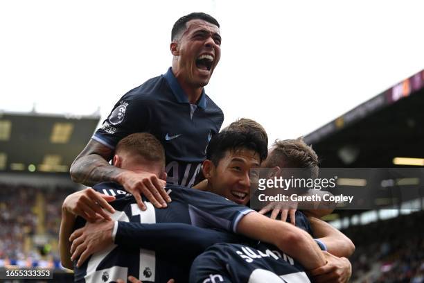 James Maddison of Tottenham Hotspur celebrates with teammates after scoring the team's third goal as Pedro Porro jumps on top during the Premier...