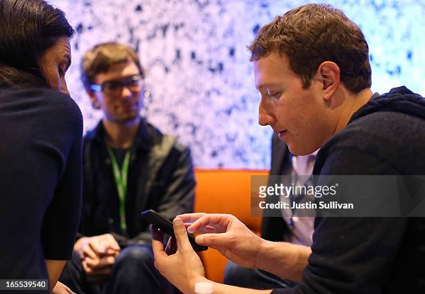 Facebook CEO Mark Zuckerberg demonstrates the new "Home" program during an event at Facebook headquarters during an event at Facebook headquarters on...