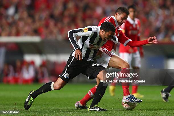 Rodrigo of Benfica is tracked by James Perch of Newcastle United during the UEFA Europa League Quarter- Final First Leg match between Benfica and...