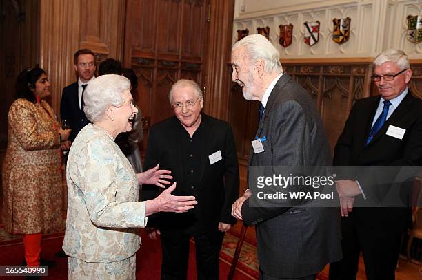 Queen Elizabeth II meets actor Christopher Lee at a reception for the British Film Industry at Windsor Castle on April 4, 2013 in Berkshire, England.