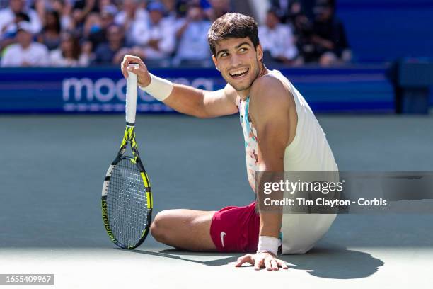 September 2: Carlos Alcaraz of Spain reacts after winning the point while slipping on the court during his match against Daniel Evans of Great...