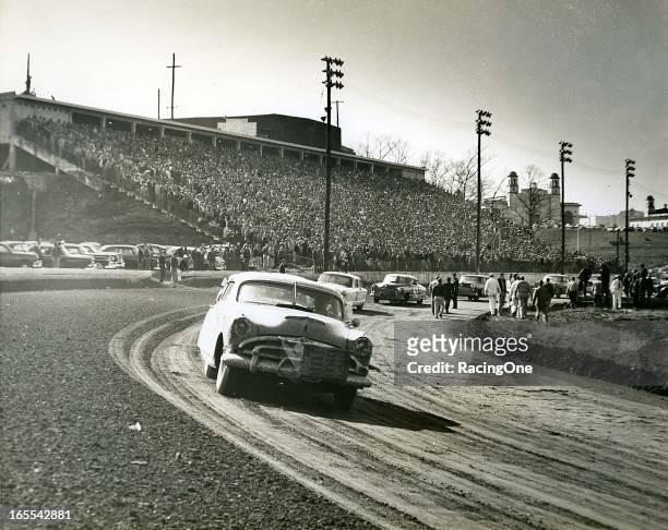 March 21, 1954: Herb Thomas leads the field in his 1953 Hudson Hornet on the pace lap for the NASCAR Cup race at Lakewood Speedway. Also pictured are...