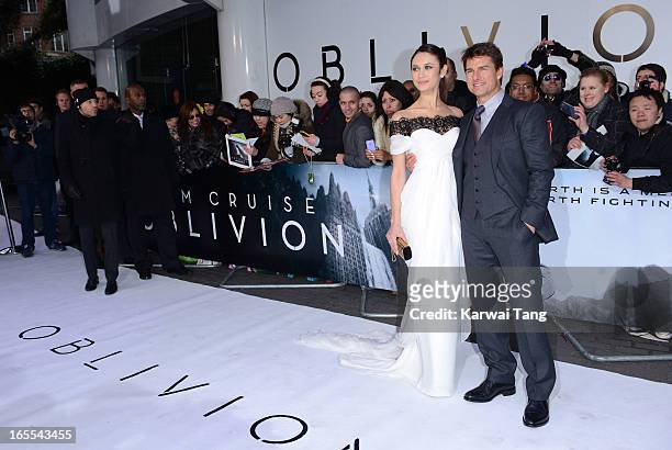 Olga Kurylenko and Tom Cruise attends the UK premiere of "Oblivion" at BFI IMAX on April 4, 2013 in London, England.