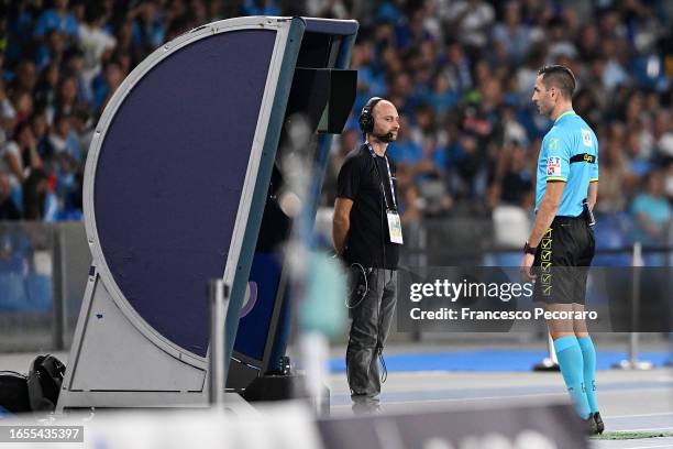 Referee Andrea Colombo consults the VAR during the Serie A TIM match between SSC Napoli and SS Lazio at Stadio Diego Armando Maradona on September...