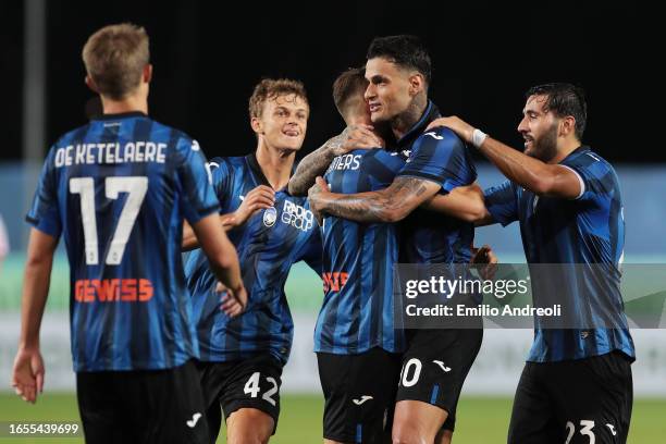 Gianluca Scamacca of Atalanta celebrates with Teun Koopmeiners and teammates after scoring the team's third goal during the Serie A TIM match between...