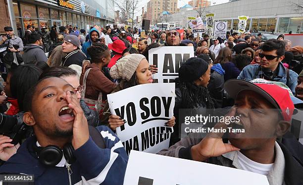 People yell during a protest for better wages for fast food workers outside a McDonald's restaurant in Harlem on April 4, 2013 in New York City....