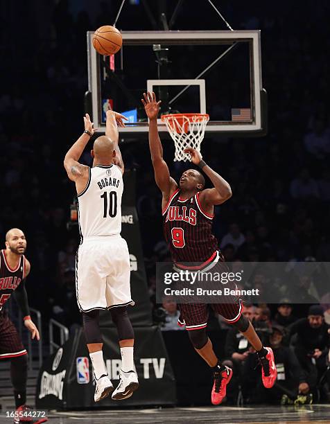 Luol Deng of the Chicago Bulls defends against Keith Bogans of the Brooklyn Nets at the Barclays Center on April 4, 2013 in New York City. NOTE TO...