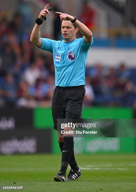 Referee Darren England makes a decision during the Premier League match between Burnley FC and Tottenham Hotspur at Turf Moor on September 02, 2023...