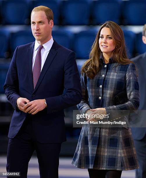 Prince William, Earl of Strathearn and Catherine, Countess of Strathearn watch an athletics demonstration as they visit the Emirates Arena on April...
