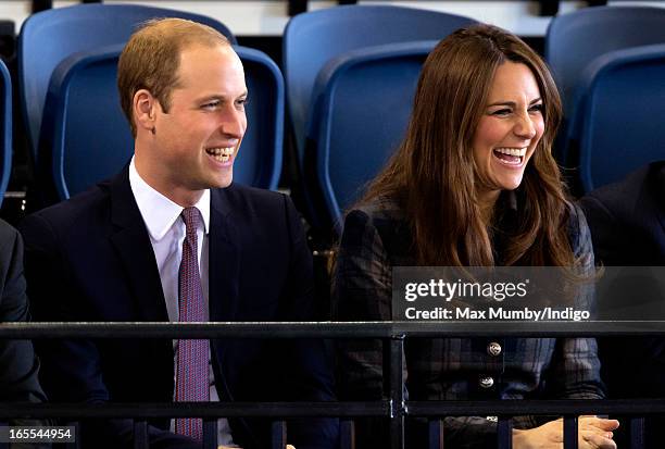 Prince William, Earl of Strathearn and Catherine, Countess of Strathearn watch an athletics demonstration as they visit the Emirates Arena on April...