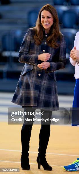 Catherine, Countess of Strathearn watches an athletics demonstration as she and Prince William, Earl of Strathearn visit the Emirates Arena on April...