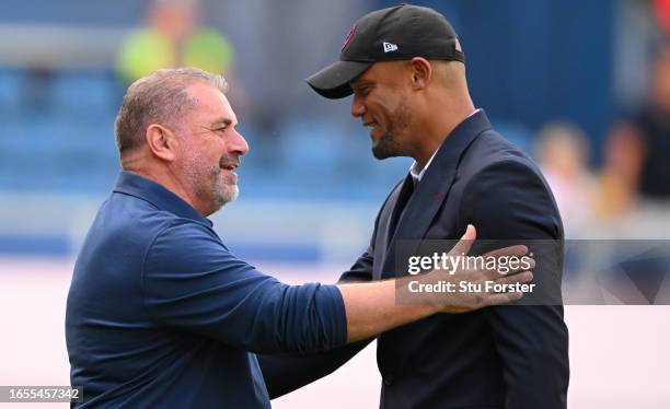 Spurs head coach Ange Postecoglou greets Vincent Kompany prior to the Premier League match between Burnley FC and Tottenham Hotspur at Turf Moor on...