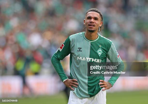 Justin Njinmah of Werder Bremen reacts following the team's victory during the Bundesliga match between SV Werder Bremen and 1. FSV Mainz 05 at...