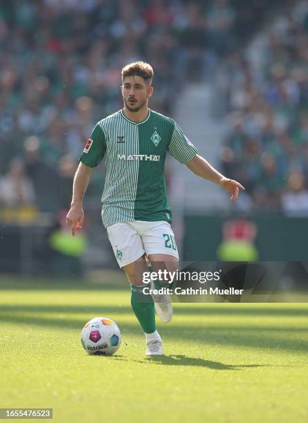 Romano Schmid of Werder Bremen runs with the ball during the Bundesliga match between SV Werder Bremen and 1. FSV Mainz 05 at Wohninvest Weserstadion...