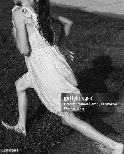 lower section of girl running barefoot - girls in wet dresses stock-fotos und bilder