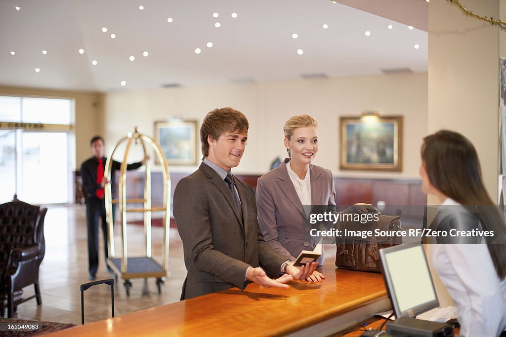 Businesswoman checking in to hotel