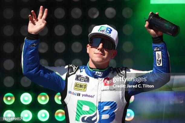 John Hunter Nemechek, driver of the Pye Barker Fire & Safety Toyota, waves to fans as he walks onstage during driver intros prior to the NASCAR...