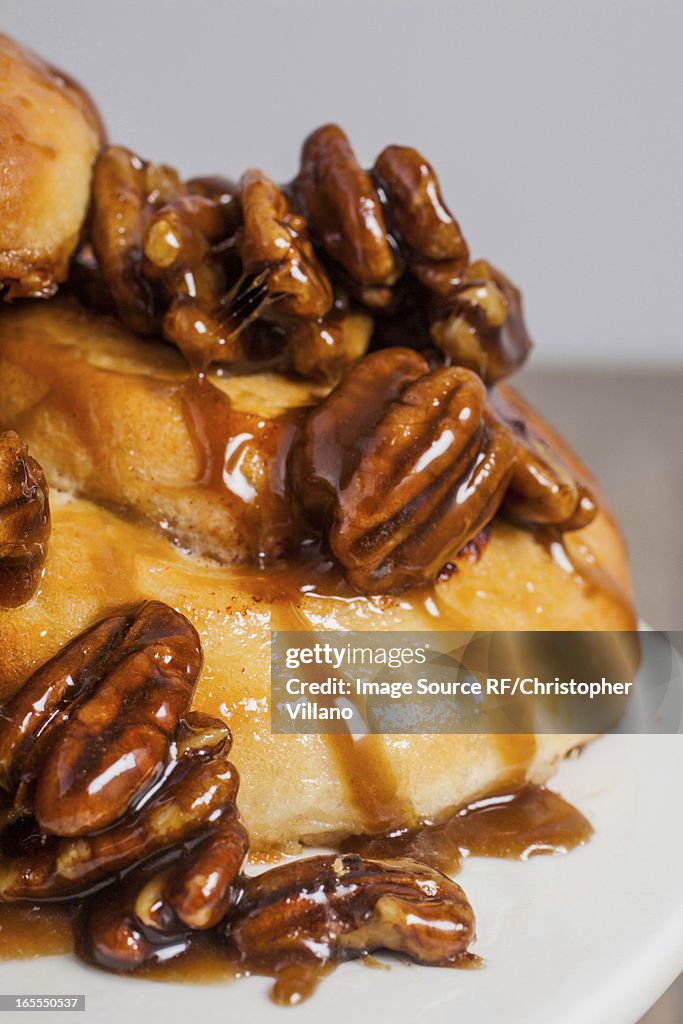 Close up of pecans on sticky buns