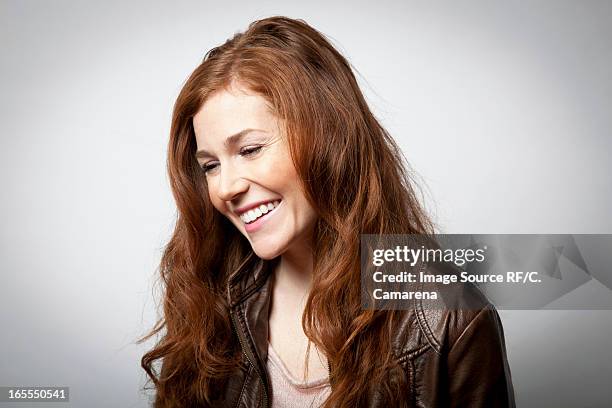 smiling woman laughing indoors - look down stock pictures, royalty-free photos & images