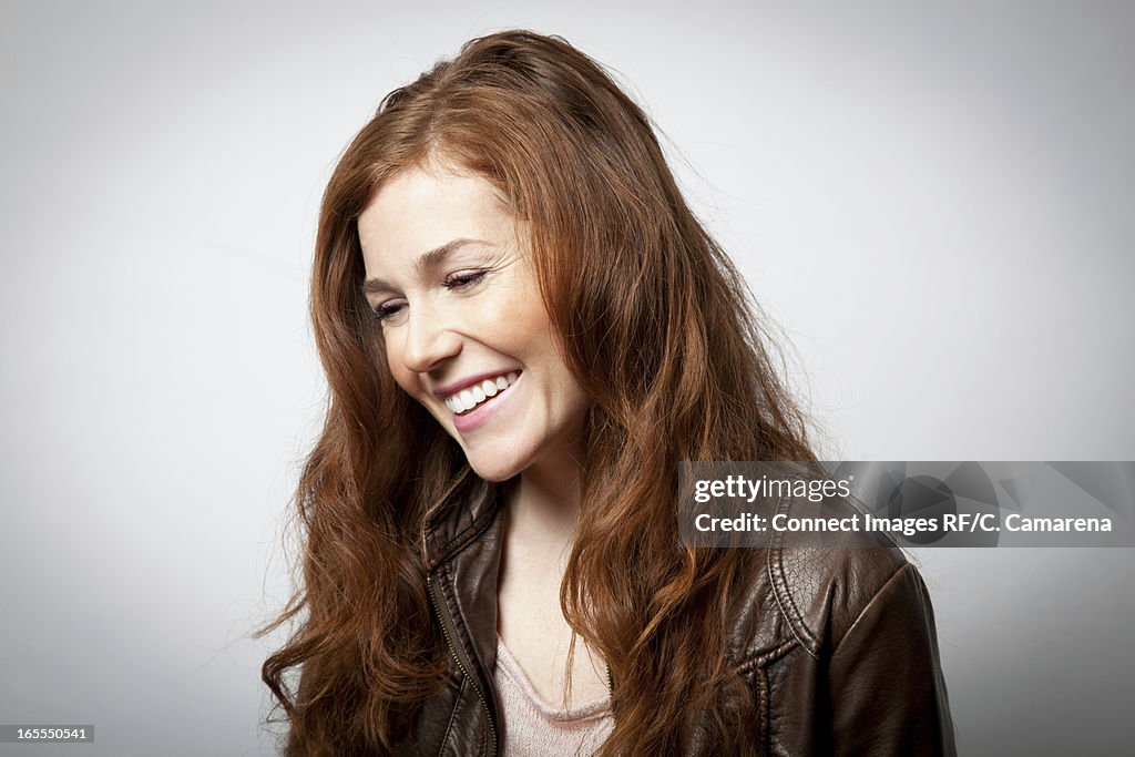 Smiling woman laughing indoors