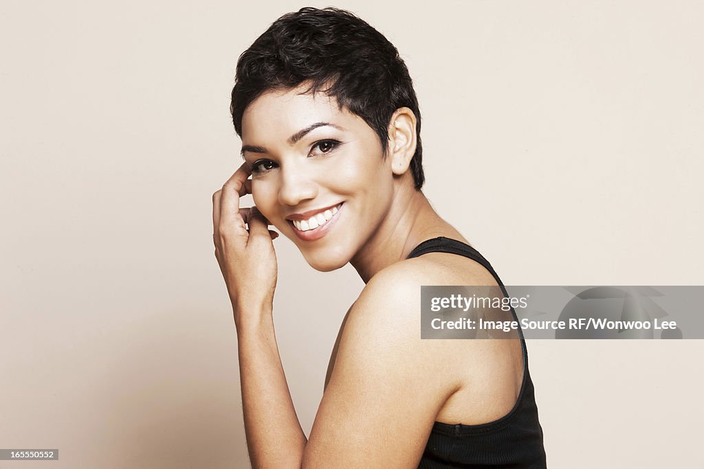 Smiling woman standing indoors