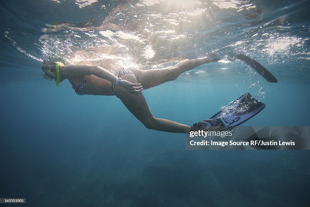 Woman snorkeling in tropical water