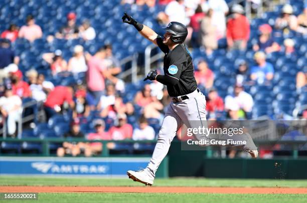 Jake Burger of the Miami Marlins rounds the bases after hitting a home run in the first inning against the Washington Nationals at Nationals Park on...