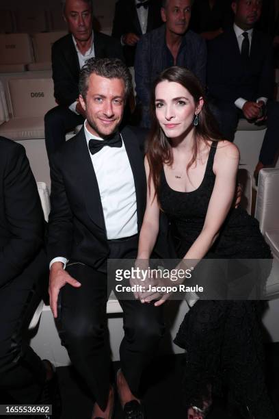Francesco Carrozzini and Bee Shaffer attend Giorgio Armani "One Night In Venice" front row on September 02, 2023 in Venice, Italy.