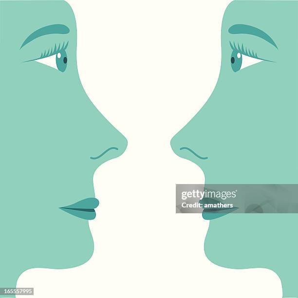 two profiled faces looking at each other - chin stock illustrations