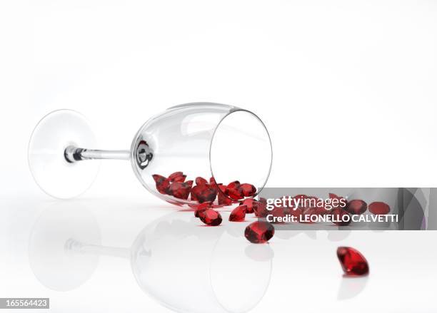 rubies spilling from a wine glass - ruby gemstone stock illustrations