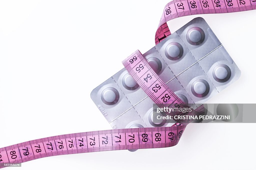 Slimming pills, conceptual image