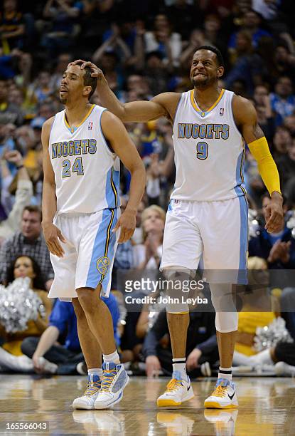 Andre Iguodala of the Denver Nuggets puts his hand on Andre Miller of the Denver Nuggets head after scoring and getting fouled int he fourth quarter...