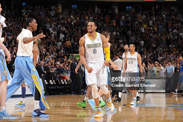 Andre Iguodala of the Denver Nuggets celebrates after making a go-ahead layup late in the fourth quarter against the Dallas Mavericks, leading to his...