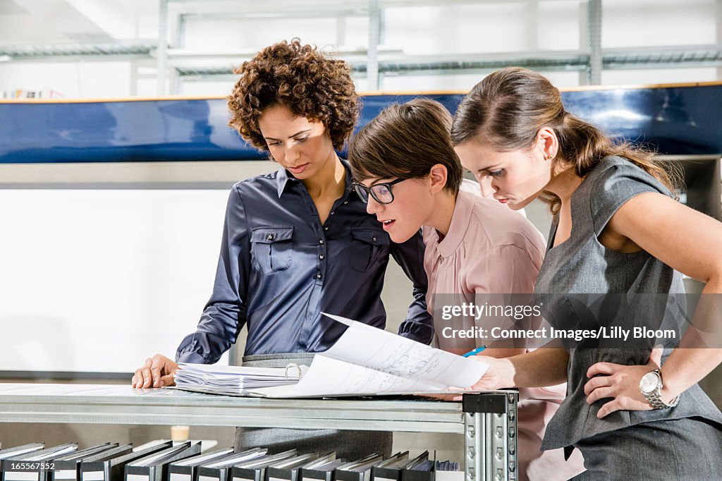 Businesswomen reading in office