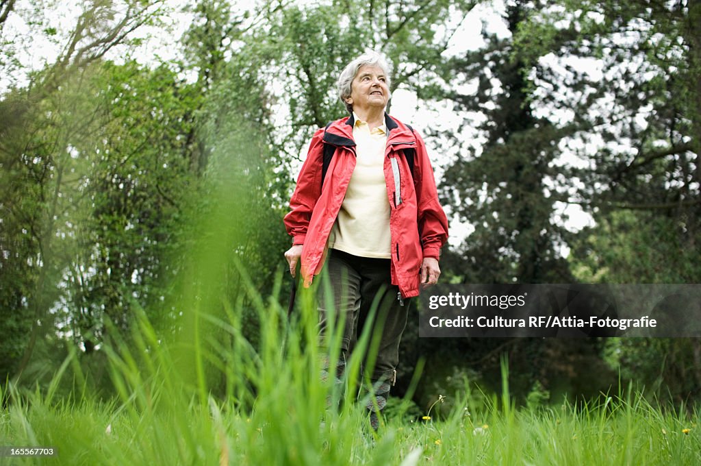Older woman walking in park