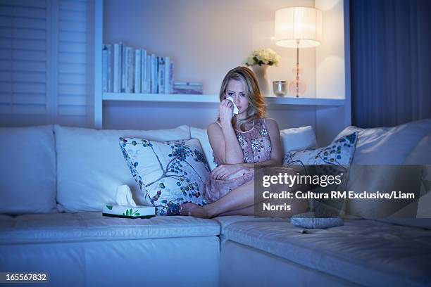 crying woman watching television - film 2012 fotografías e imágenes de stock