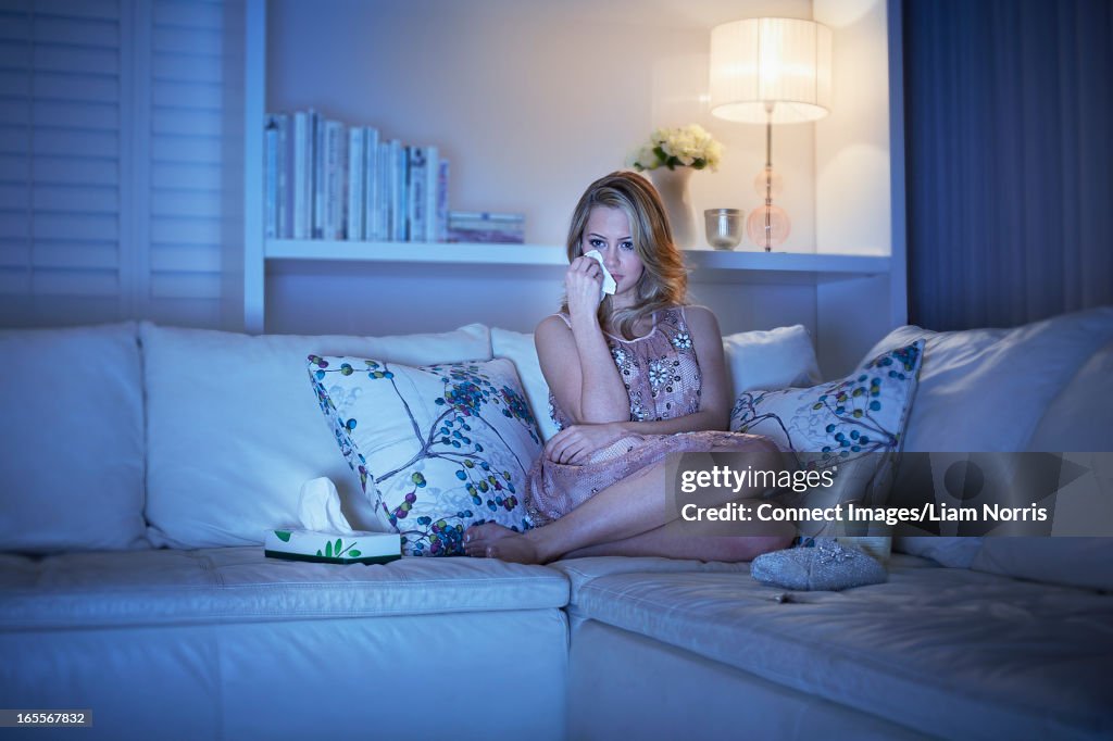 Crying woman watching television