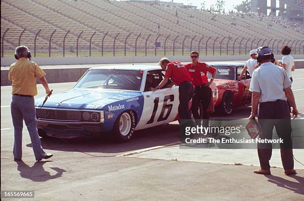 Miller 500 - NASCAR - Ontario Motor Speedway. Mark Donohue of Penske Racing sits near the end of pit lane during qualifying in his AMC Matador...