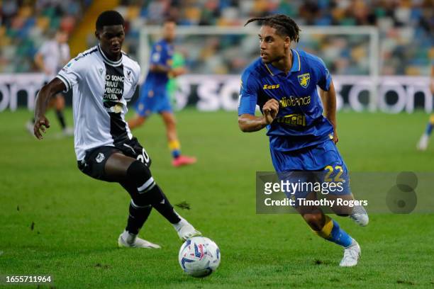 Anthony Oyono of Frosinone controls the ball under pressure from Vivaldo Semedo of Udinese during the Serie A TIM match between Udinese Calcio and...