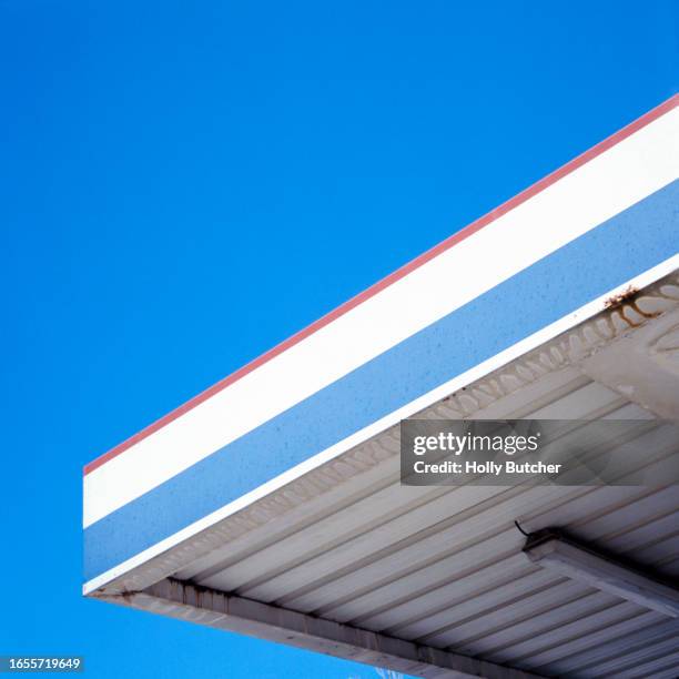 abstract square corner of a french petrol station with a red, white, and blue design - station service france stock pictures, royalty-free photos & images