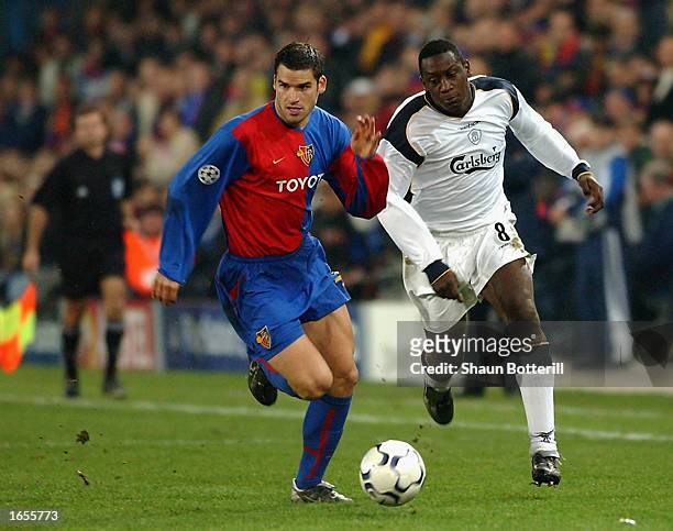 Emile Heskey of Liverpool takes the ball past Bernt Haas of FC Basel during the UEFA Champions League First Phase Group B match held on November 12,...